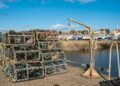 Cold fresh day in Anstruther, Fife. Empty fishing baskets piled up high ready for the next catch.