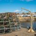 Cold fresh day in Anstruther, Fife. Empty fishing baskets piled up high ready for the next catch.