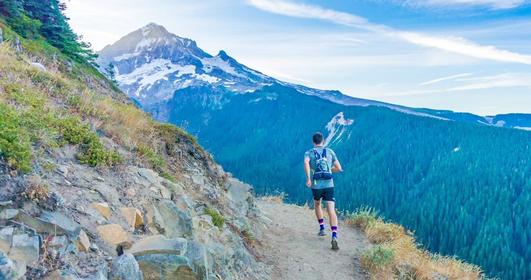 It seemed like a crazy dream: could we run a 43 mile hiking route in one day? Neither of us had ever tried such an ambitious adventure. Here, my friend spots the mountain for the first time. We made it around!