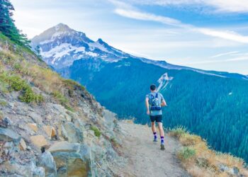 It seemed like a crazy dream: could we run a 43 mile hiking route in one day? Neither of us had ever tried such an ambitious adventure. Here, my friend spots the mountain for the first time. We made it around!
